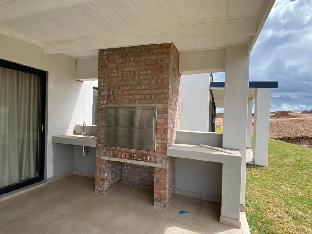 Braai on stoep of the Renosterbos show house. Schoeman Trio Builders residential building, Hartenbos