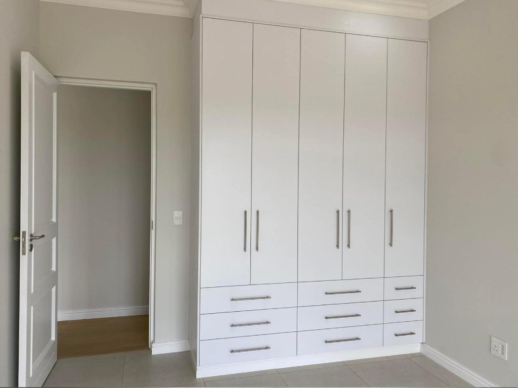 Bedroom cupboards in the Renosterbos show house. Schoeman Trio Builders residential building, Hartenbos