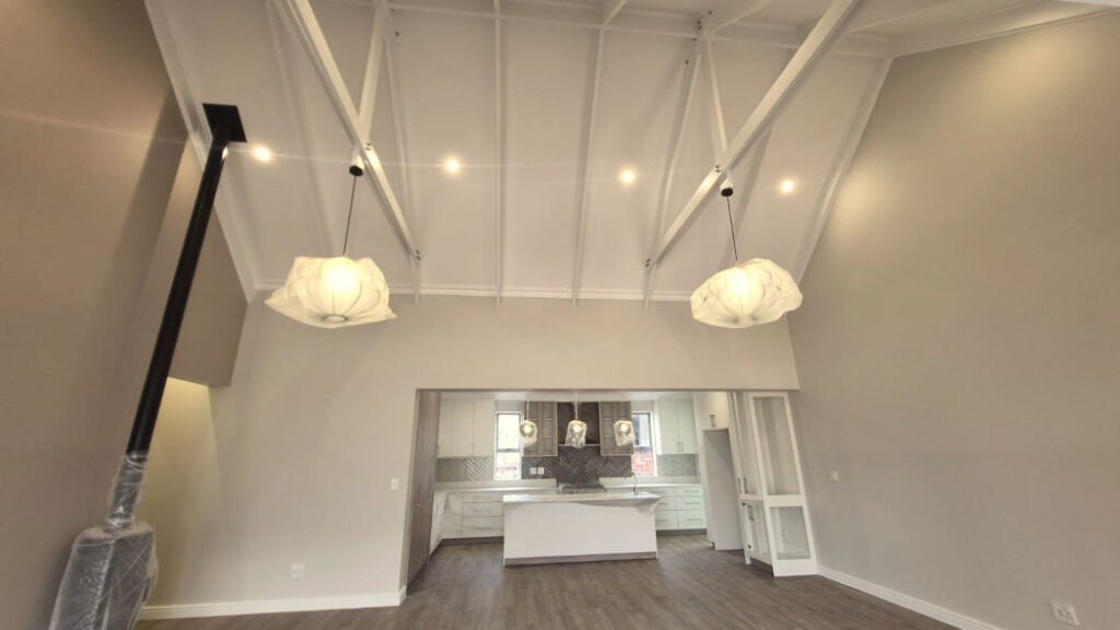 A modern coastal farmhouse-style residence in Renosterbos, Mossel Bay, by Schoeman Trio Builders